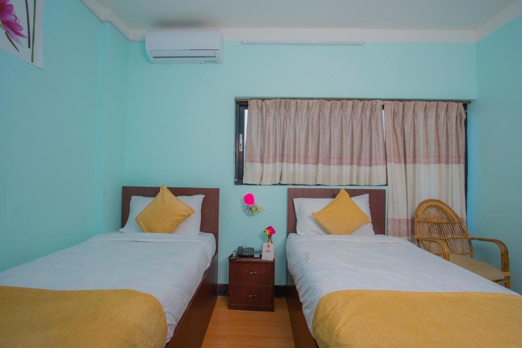 Postel nebo postele na pokoji v ubytování Hotel Golden Three