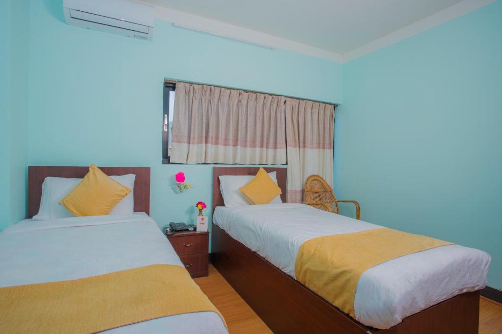 Postel nebo postele na pokoji v ubytování Hotel Golden Three