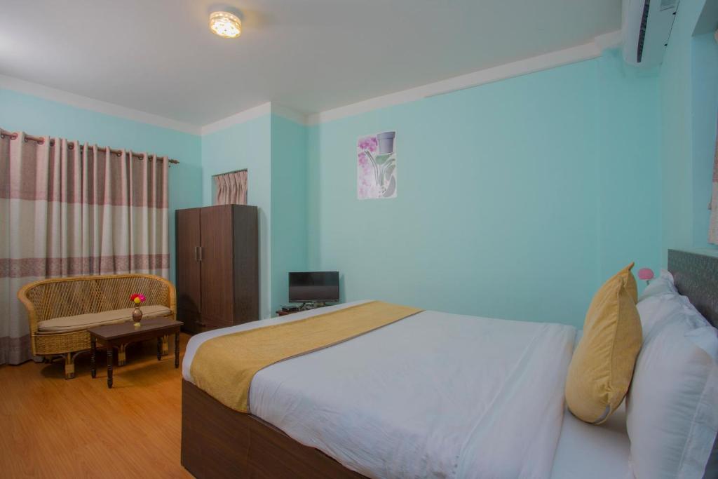 Postel nebo postele na pokoji v ubytování Hotel Golden Three