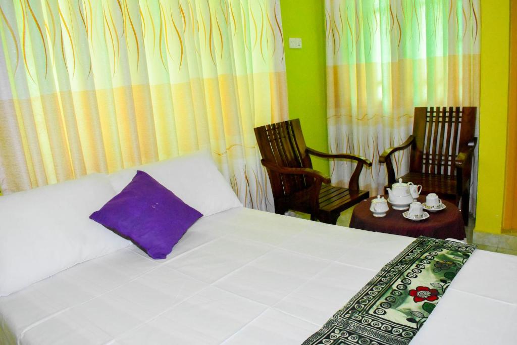 Postel nebo postele na pokoji v ubytování Thuru Sisila Resort