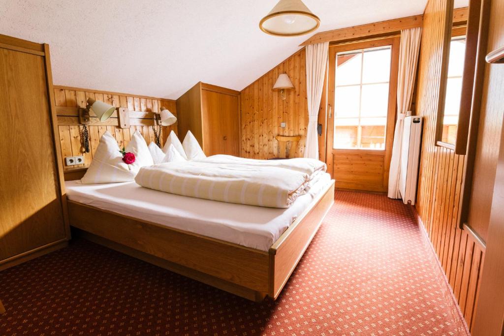 Postel nebo postele na pokoji v ubytování Gaestehaus Berger