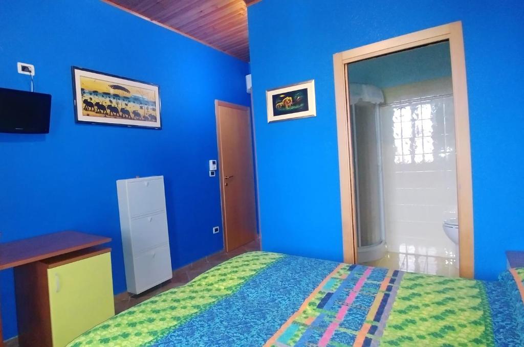 Postel nebo postele na pokoji v ubytování Porto Recanati Zimmer