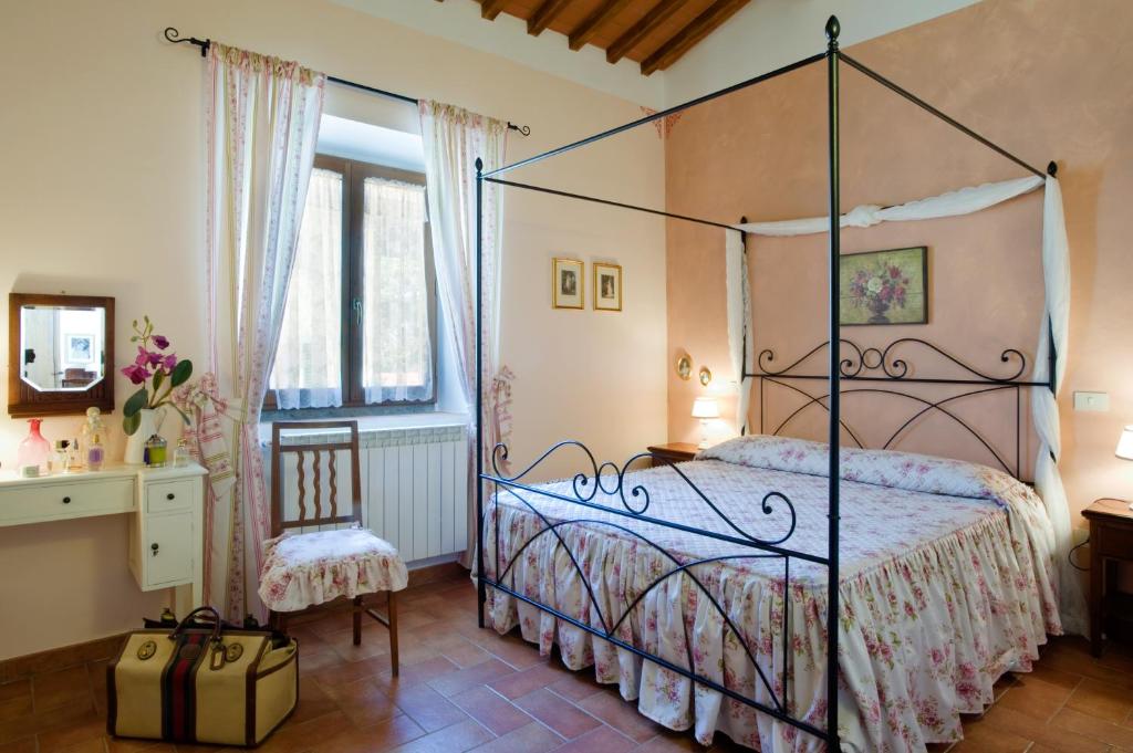 Postel nebo postele na pokoji v ubytování Agriresort & Spa Fattoria I Ricci