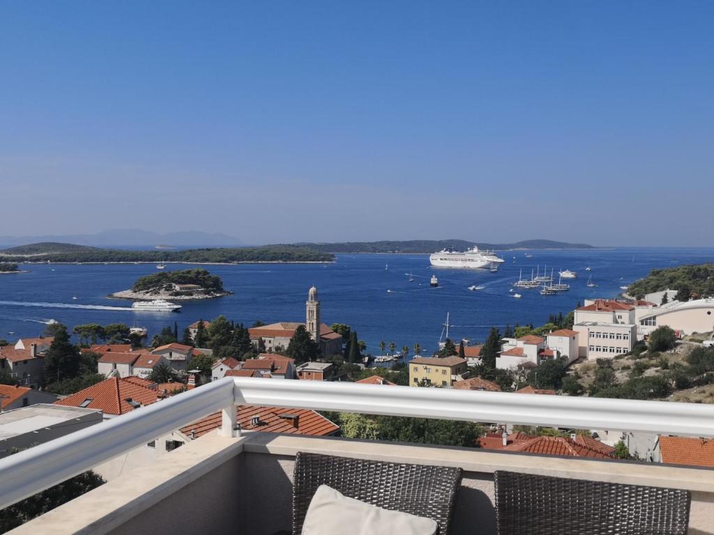 a balcony with a view of the water at APARTMANI KREŠIĆ 1 HVAR in Hvar