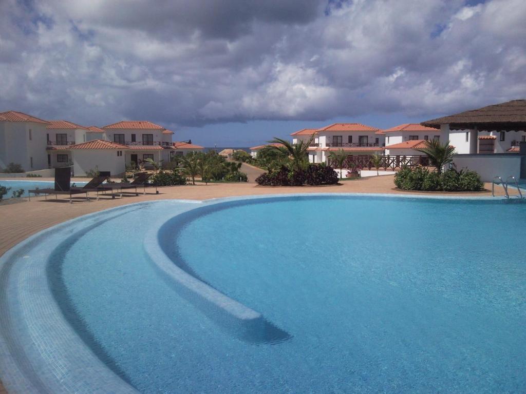 Bazén v ubytování Private Apartment At Tortuga Beach Resort and Spa nebo v jeho okolí