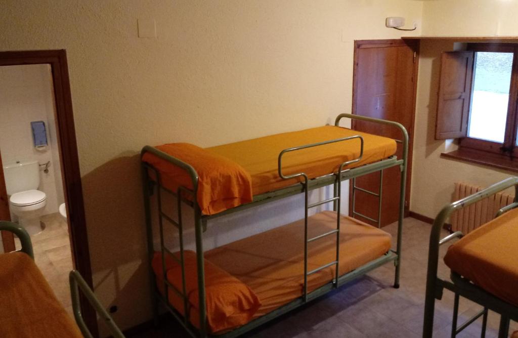 Postel nebo postele na pokoji v ubytování Alberg-Casa De Colònies Ridolaina