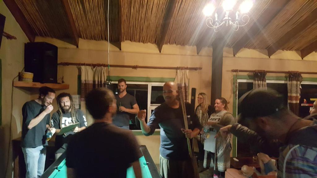 a group of people standing in a room at The Wild Farm Backpackers in Wilderness