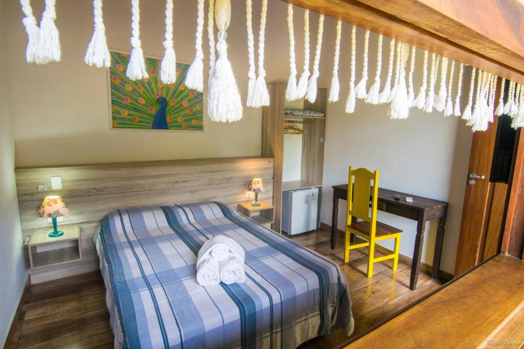 Postel nebo postele na pokoji v ubytování Pousada Miracolo