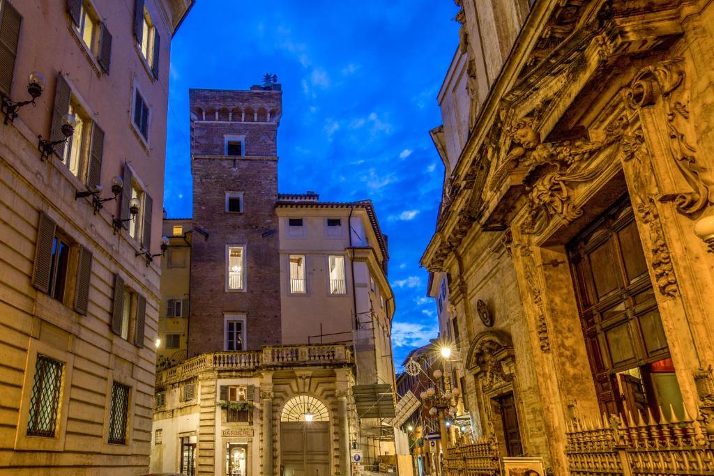 a street in the city at night at Guesthouse MySuiteTower Pantheon in Rome