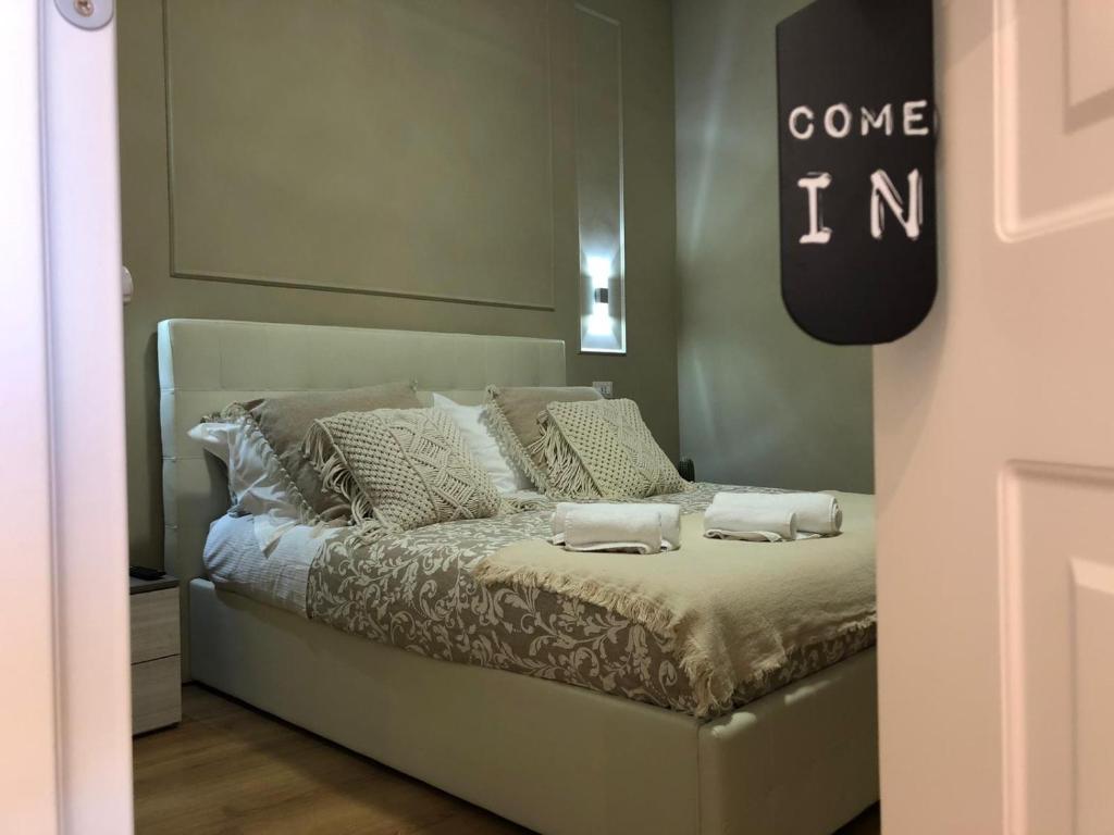 a bed with two pillows on it in a room at Pantheon Luxury Suite in Rome