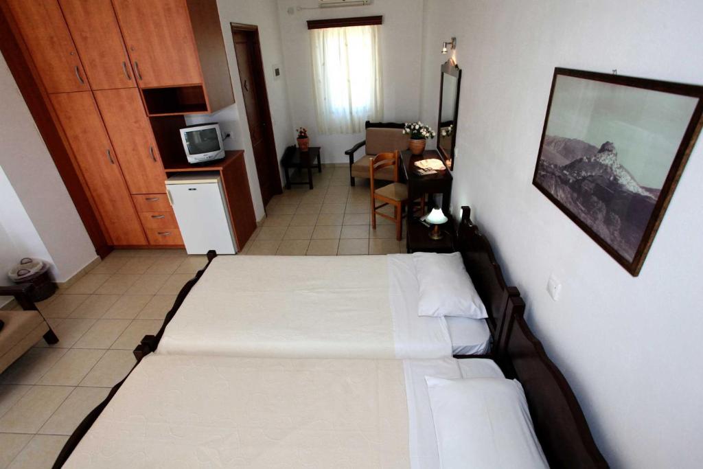 Postel nebo postele na pokoji v ubytování Hotel Melikari
