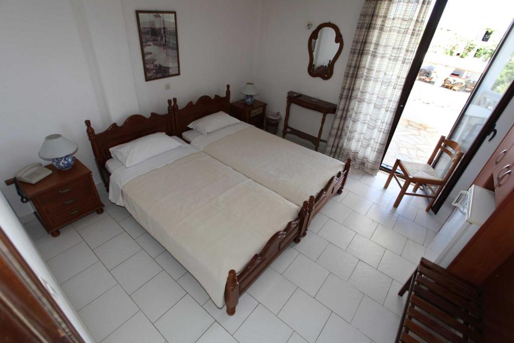 Postel nebo postele na pokoji v ubytování Hotel Melikari