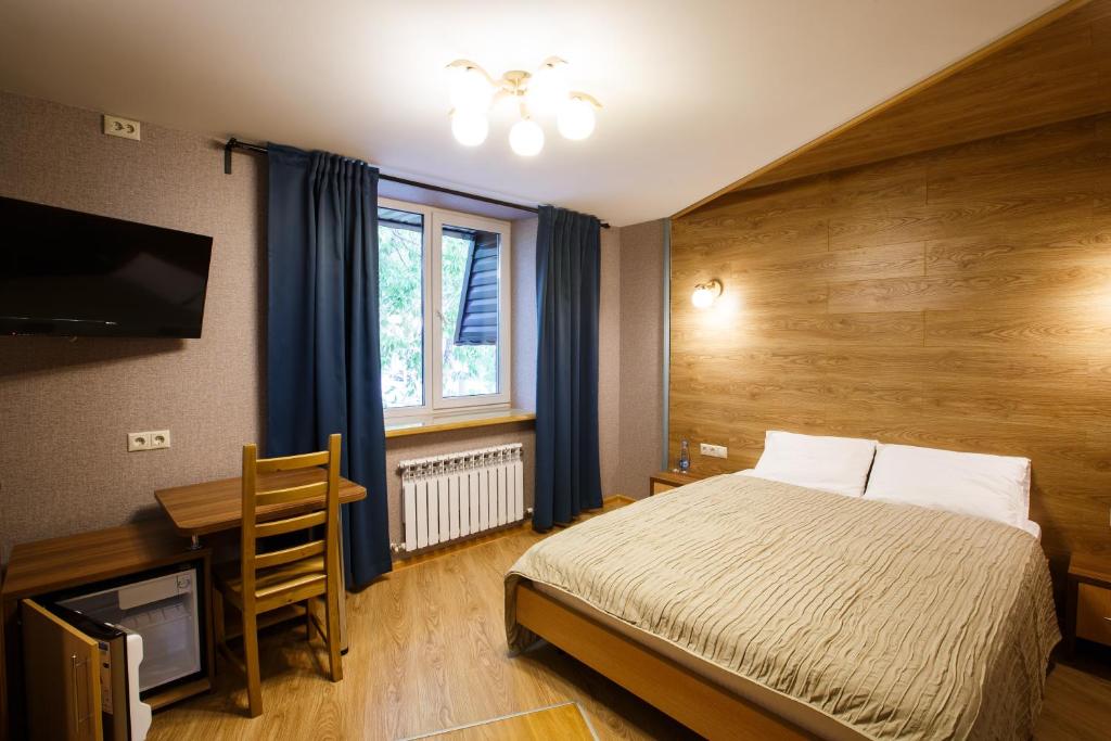  Кровать или кровати в номере Парисон 