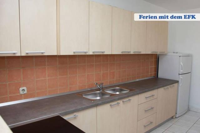 Kuchyň nebo kuchyňský kout v ubytování Centrally located apartment for 16