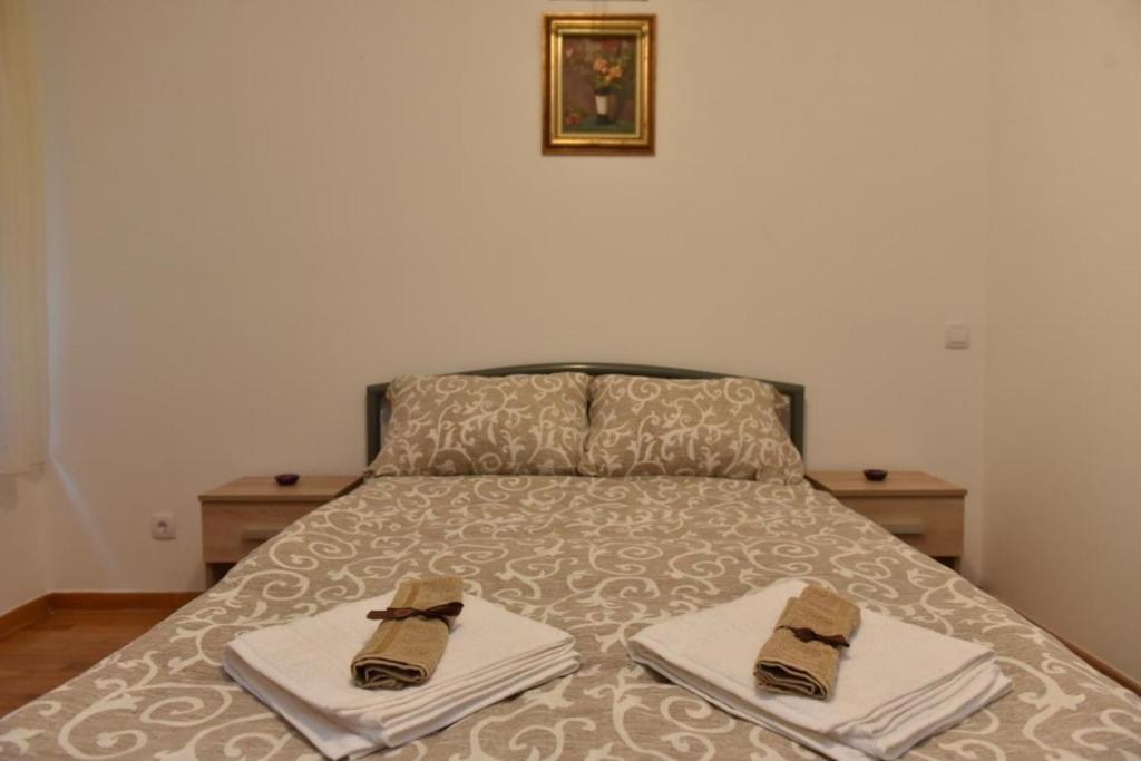 Postel nebo postele na pokoji v ubytování Promenada apartmani