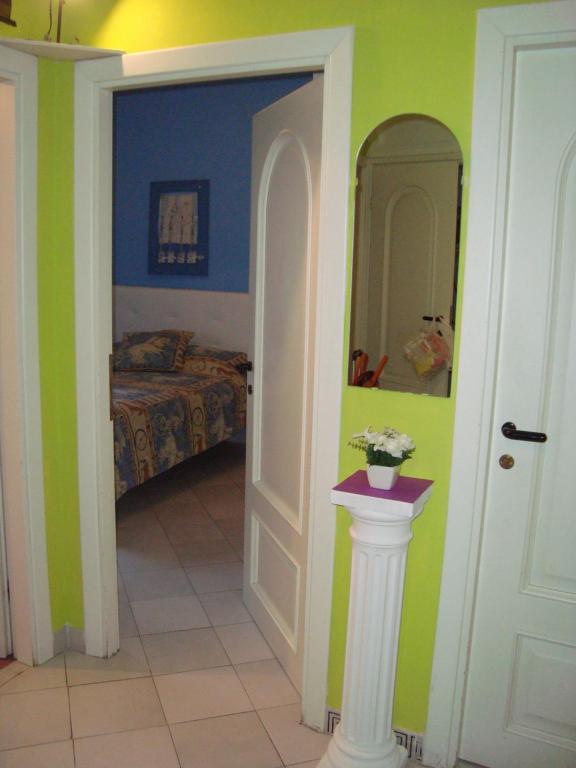A bed or beds in a room at La Casa Dei Gerani