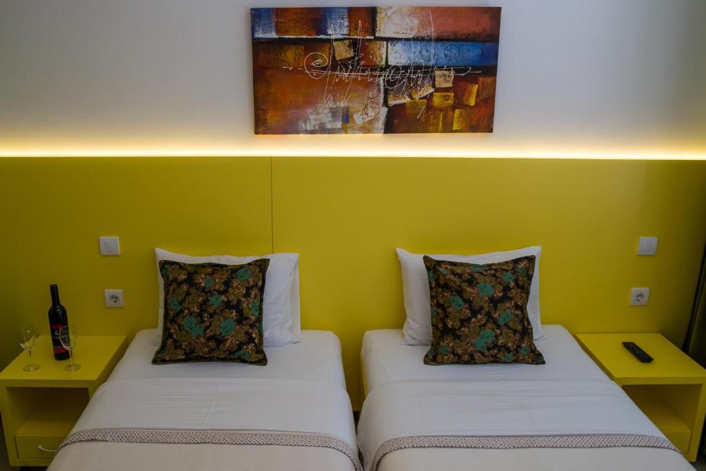 Ένα ή περισσότερα κρεβάτια σε δωμάτιο στο SAN 011