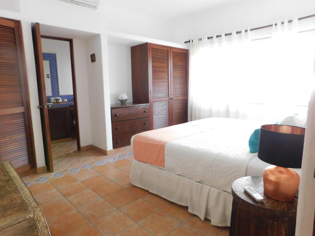 Postel nebo postele na pokoji v ubytování Fabiola Condo Hotel