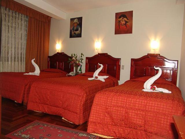 Postel nebo postele na pokoji v ubytování Hotel Inkayra