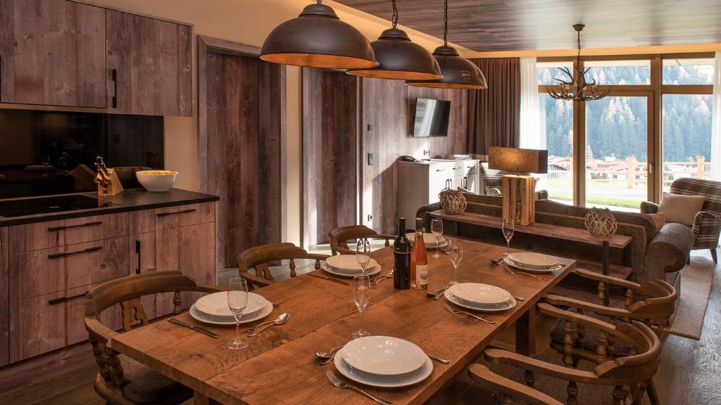 Televízia a/alebo spoločenská miestnosť v ubytovaní Mountain Spa Residences
