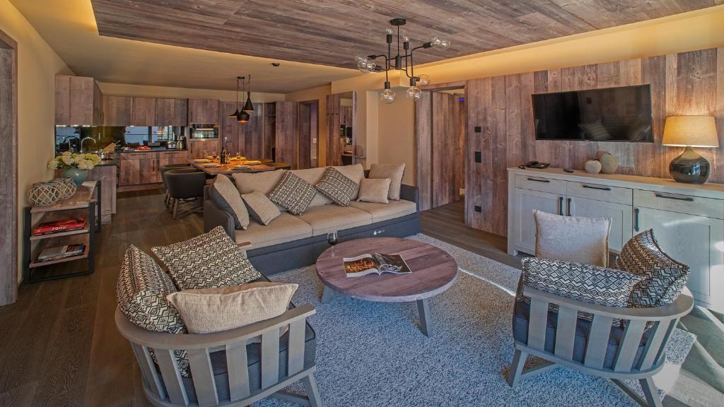 Televízia a/alebo spoločenská miestnosť v ubytovaní Mountain Spa Residences