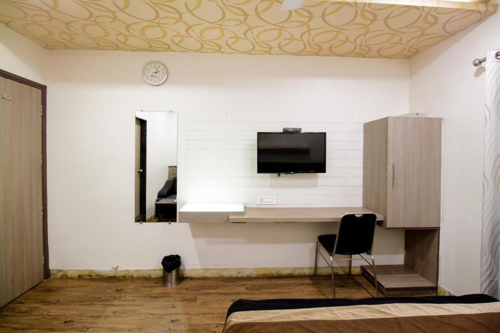 TV a/nebo společenská místnost v ubytování Hotel City Inn