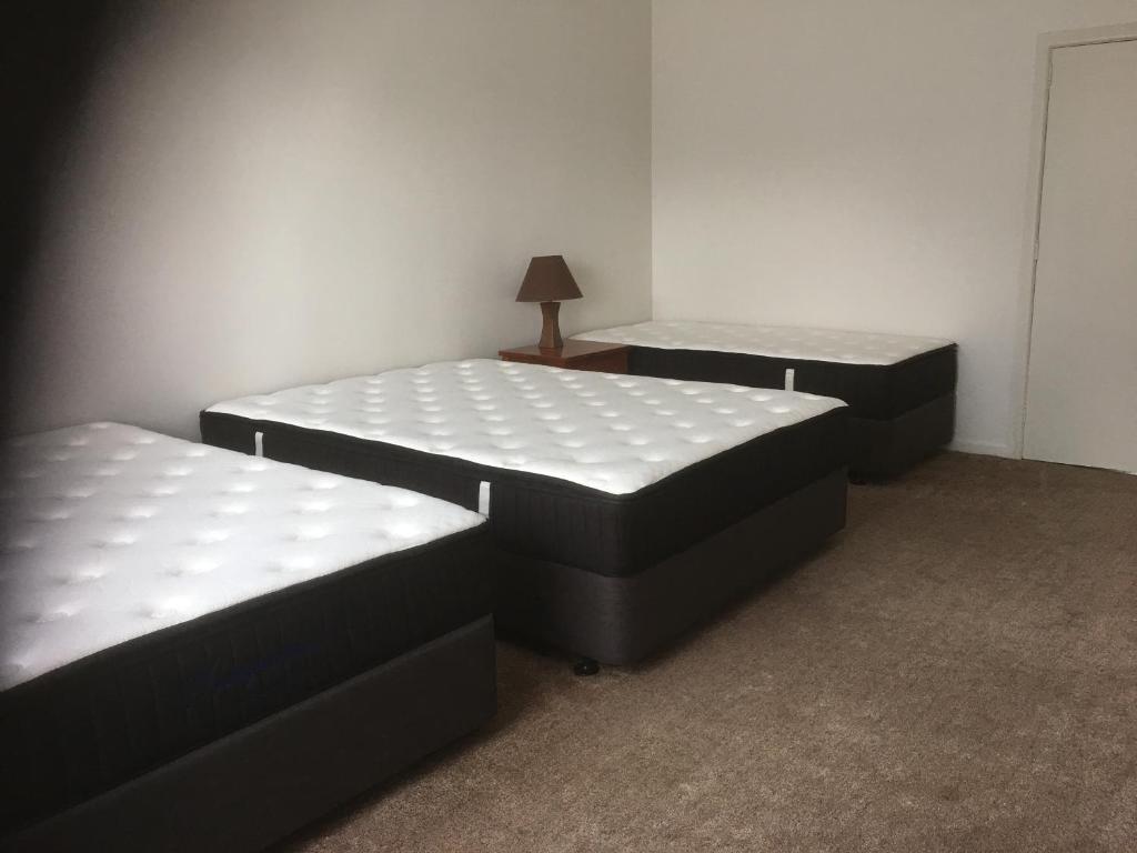 Postel nebo postele na pokoji v ubytování Mini Homestay