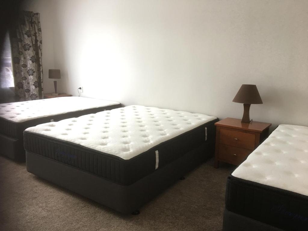 Postel nebo postele na pokoji v ubytování Mini Homestay
