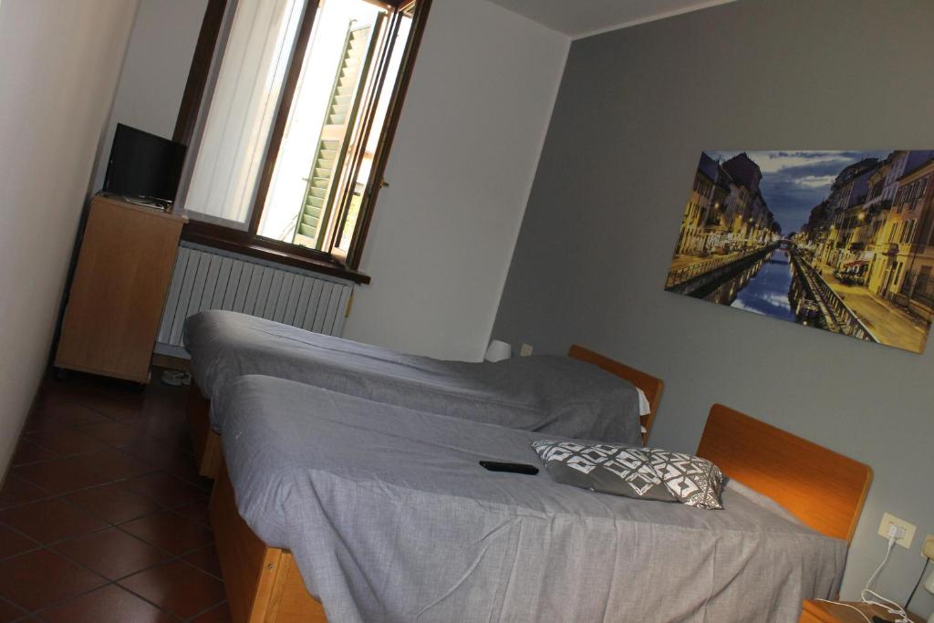Voodi või voodid majutusasutuse ALBERGO LA SCALETTA toas