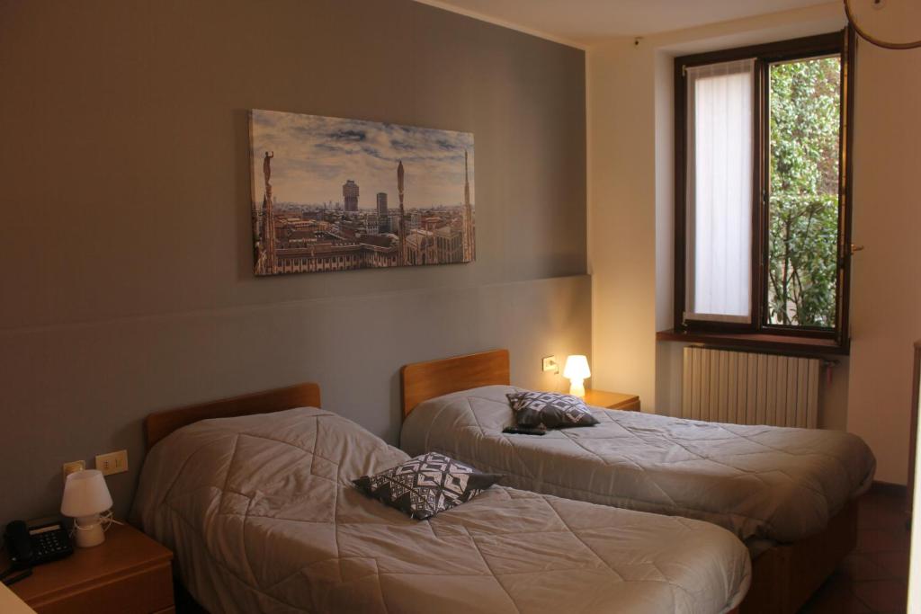 Voodi või voodid majutusasutuse ALBERGO LA SCALETTA toas