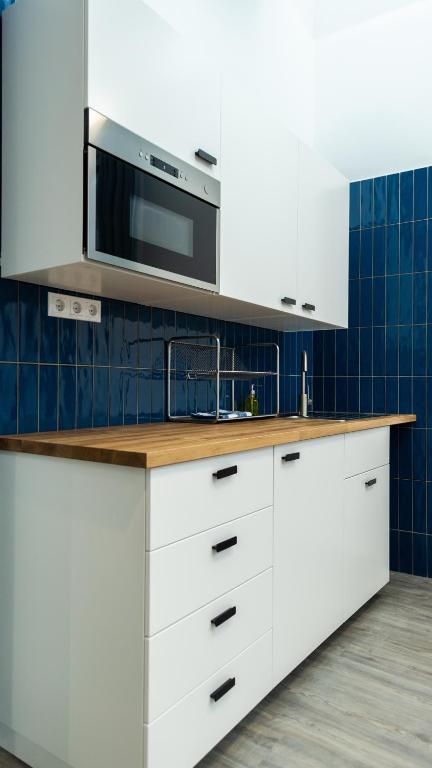 A kitchen or kitchenette at BpR Downtown Gemstone Apartments