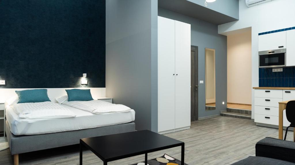 A bed or beds in a room at BpR Downtown Gemstone Apartments