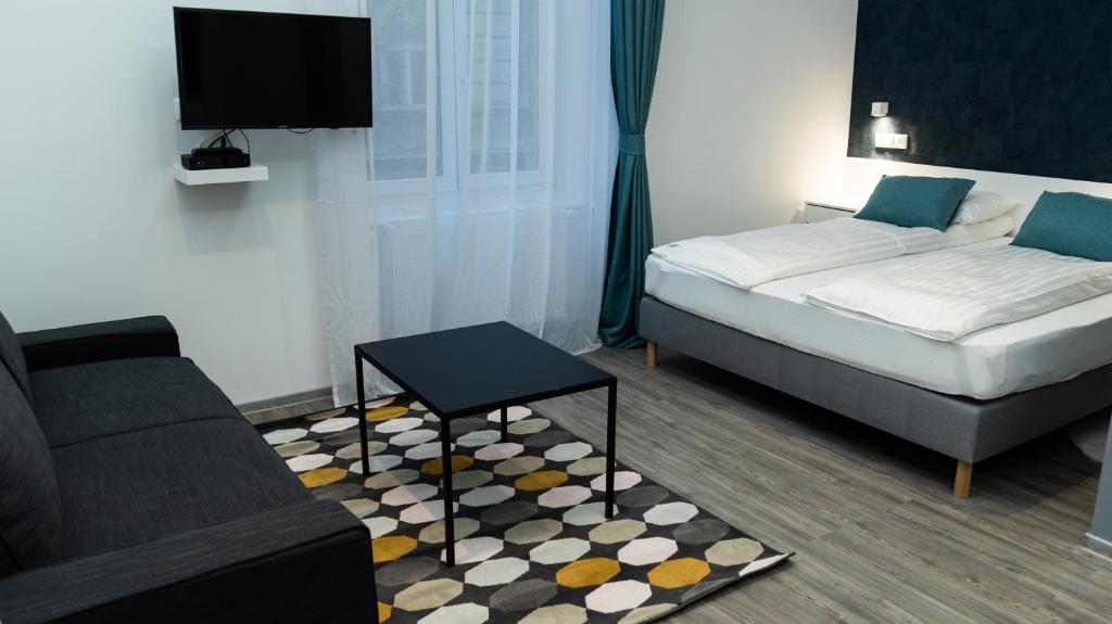 A bed or beds in a room at BpR Downtown Gemstone Apartments