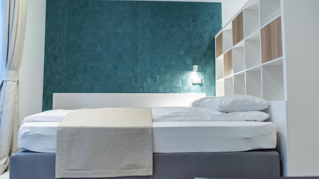 A bed or beds in a room at BpR Downtown Gemstone Apartments