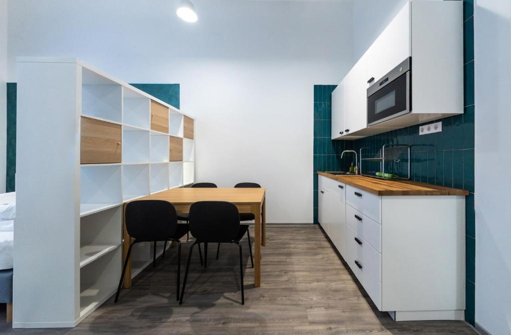 A kitchen or kitchenette at BpR Downtown Gemstone Apartments
