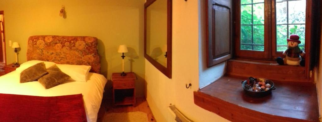 Postel nebo postele na pokoji v ubytování Traditional Rooms karaouli