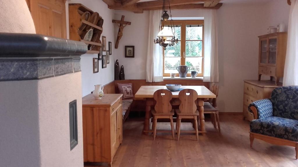 a kitchen with a table and chairs and a window at Auszeit in Göstling an der Ybbs
