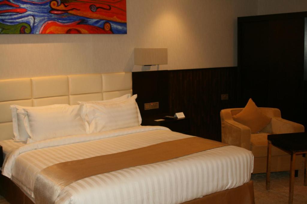 Postel nebo postele na pokoji v ubytování The Secure Inn Hotel Muscat