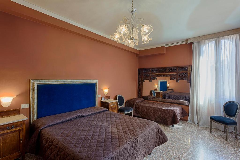 Postel nebo postele na pokoji v ubytování Hotel Guerrato