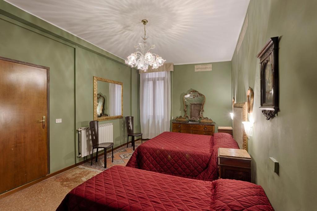 Postel nebo postele na pokoji v ubytování Hotel Guerrato