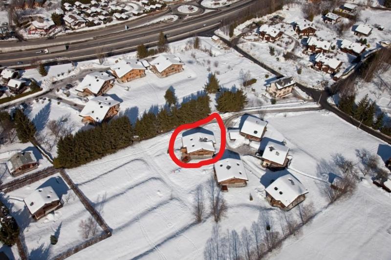 an aerial view of a snow covered parking lot with cars at CHALET CHAM'ROCK in Les Houches