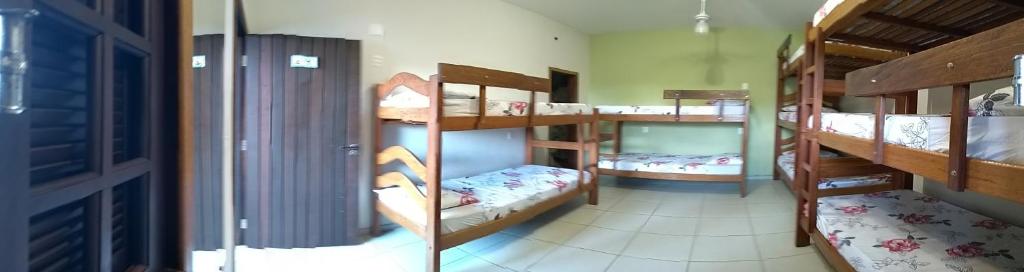 Postel nebo postele na pokoji v ubytování Harmoni Hostel & Pousada