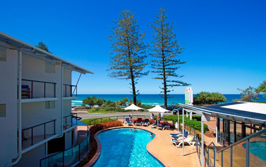 a view of the pool at a resort at The Beach Retreat Coolum in Coolum Beach