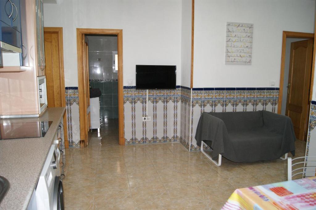 Televízia a/alebo spoločenská miestnosť v ubytovaní Casa Fuente Arriba