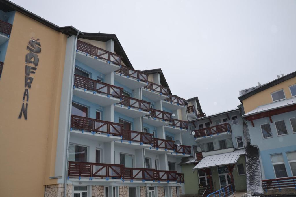 a building with balconies on the side of it at Šafrán - Dorothy 44, in Donovaly