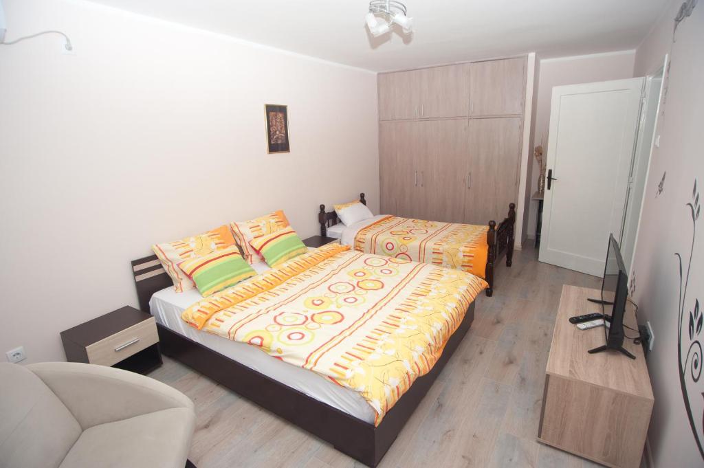 Postel nebo postele na pokoji v ubytování Park Apartman