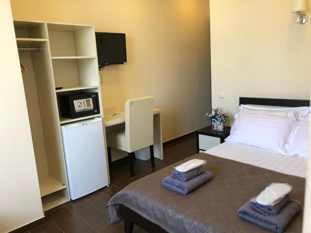 Postel nebo postele na pokoji v ubytování GNS Hotel