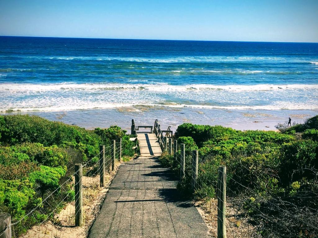 a wooden path leading down to the beach at Garland Grove in Ocean Grove