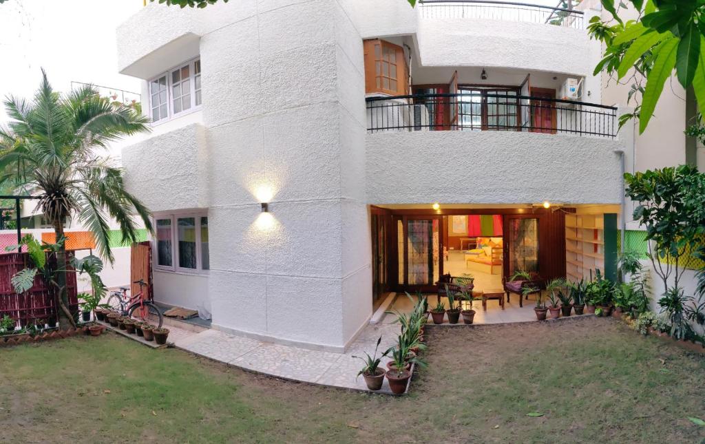 a large white building with a courtyard in front of it at Moustache Delhi in New Delhi