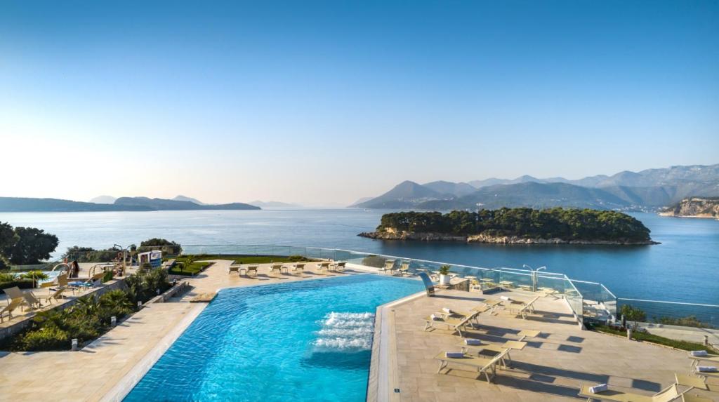 an aerial view of a resort with a swimming pool and the ocean at Valamar Argosy Hotel in Dubrovnik